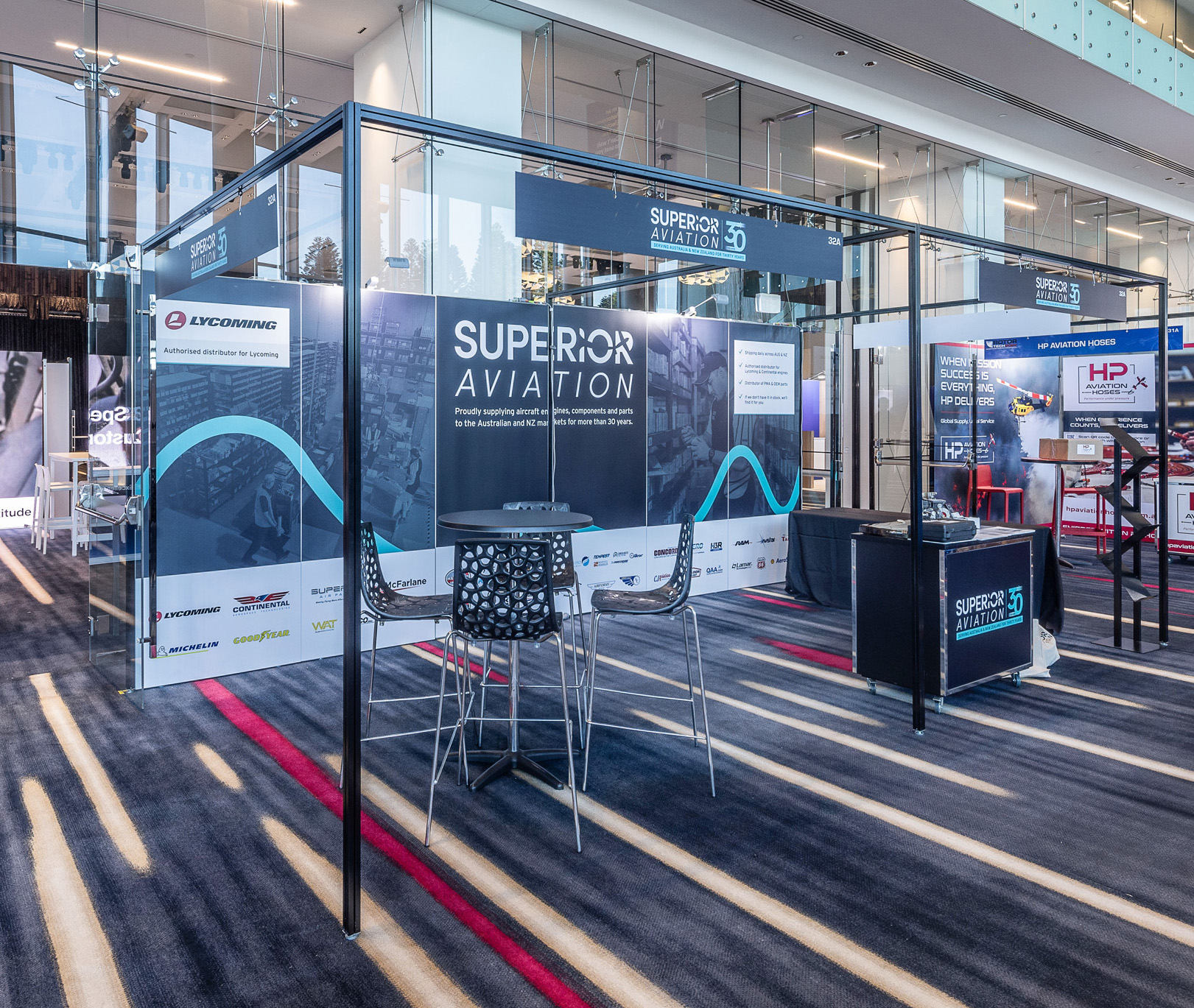 SHELL SCHEME BUILD_RotorTech Helicopter and Uncrewed Flight Exposition Gold Coast. Moreton Hire Exhibition stand. Custom signage. Australia no: 1 Hire Company. Uni Wall