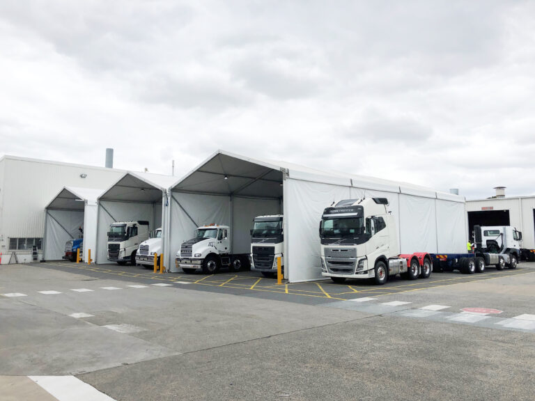Extra High Marquees protecting vehicles at Volvo
